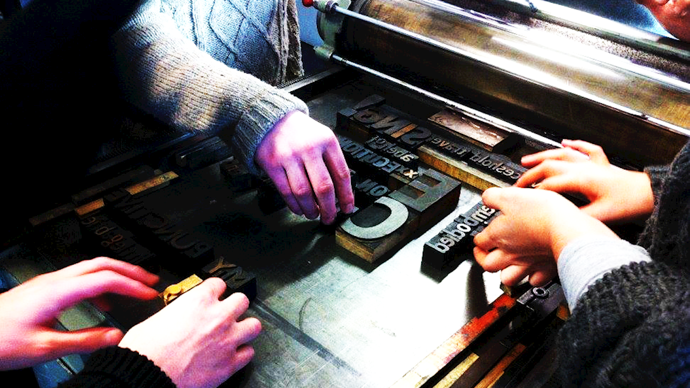 Hands with letterpress 1.png