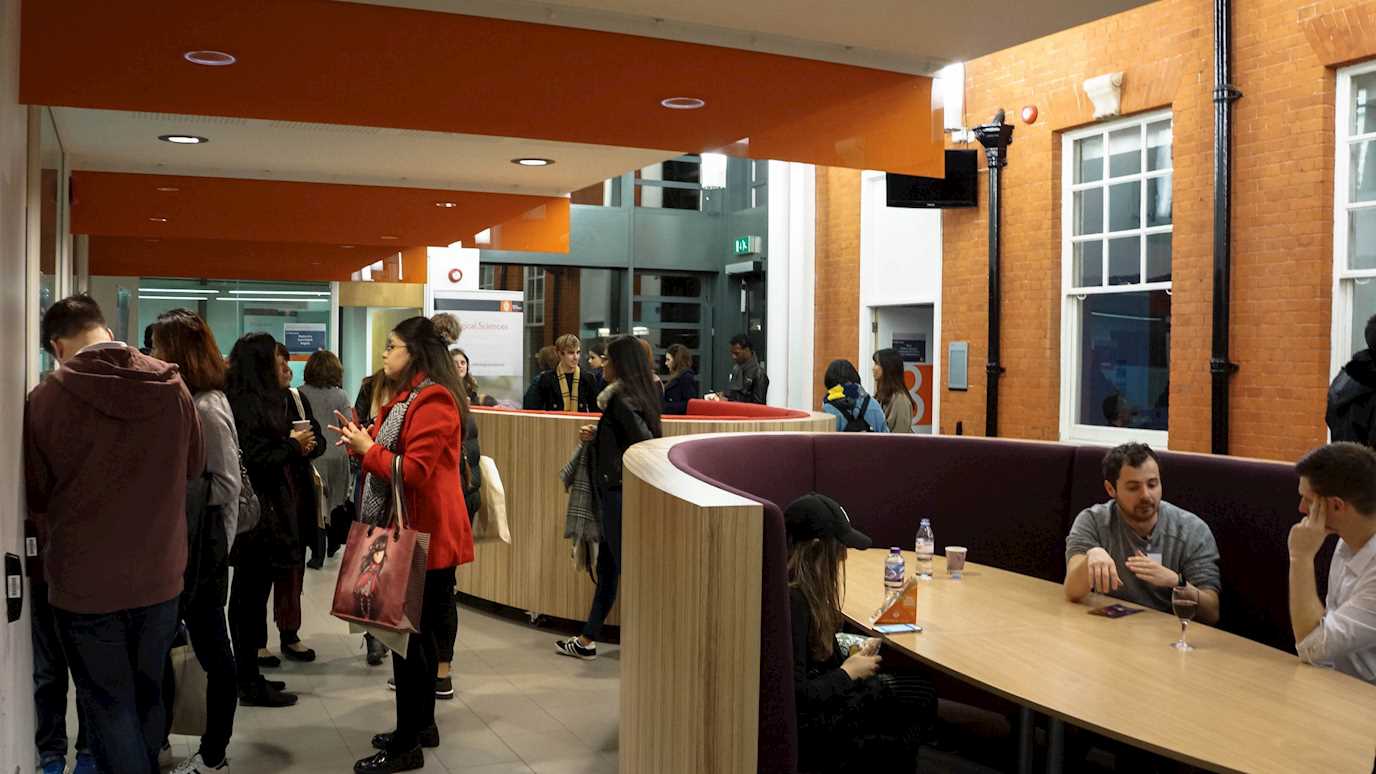 people at an open evening in the Moore Building - Postgraduate events