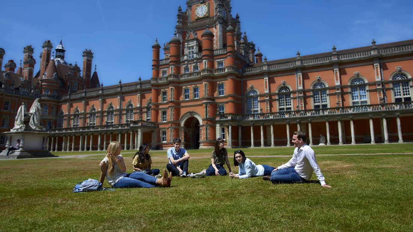 Students in north quad with clock tower - Foundation year (cropped)
